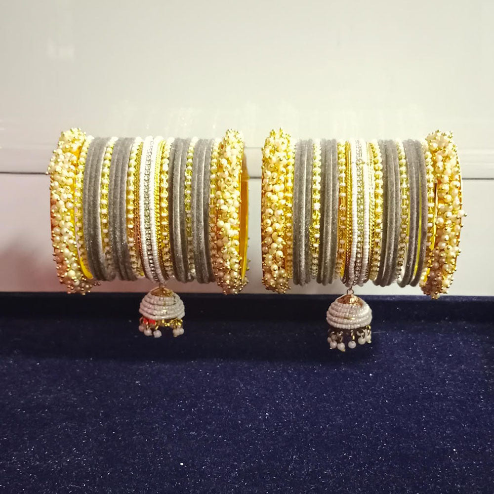 Pooja Bangles Gold Plated Austrian Stone And Pearls Velvet Bangles Set