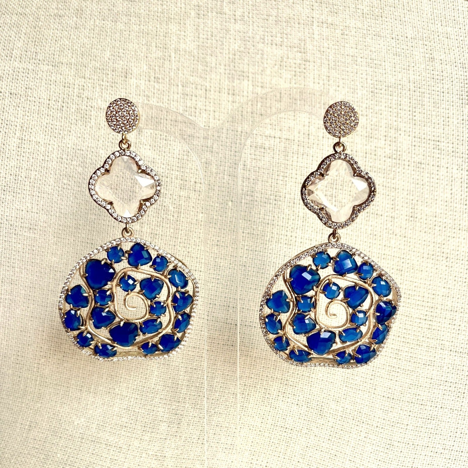 Jewel Treatzz Irregular Shaped Blue Doublet Stone, Transparent Four Petal Clover Flower And CZ Stone Gold Plated Chandlelier Earrings