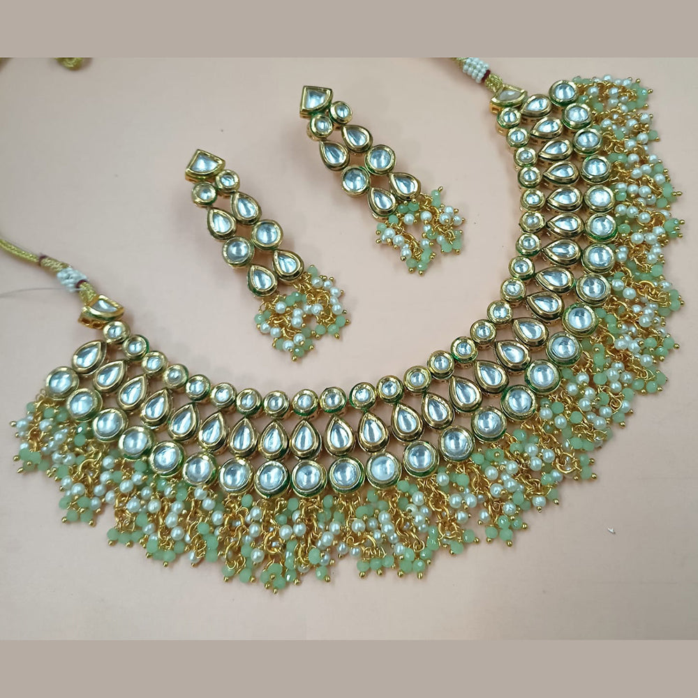 NAFJ Gold Plated Kundan Stone And Pearl Necklace Set