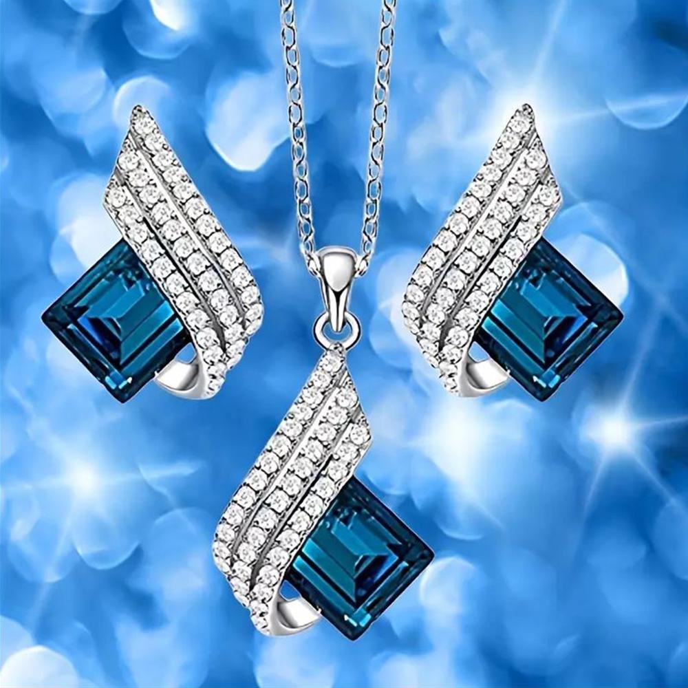 Mahi Shining Angel Wings Shaped Montana Blue and White Crystal Pendant Necklace Earrings Set for Women (NL1103810RMBlu)