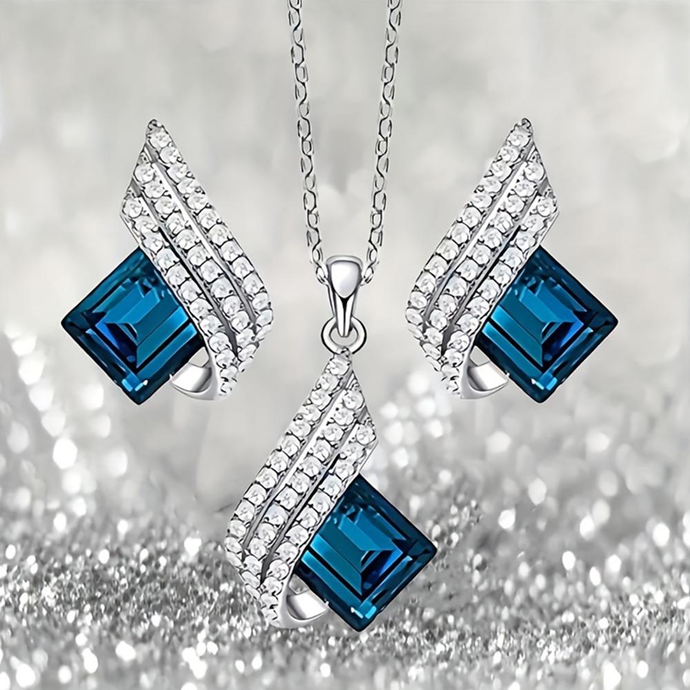 Mahi Shining Angel Wings Shaped Montana Blue and White Crystal Pendant Necklace Earrings Set for Women (NL1103810RMBlu)