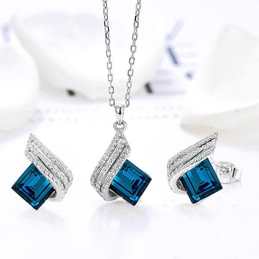 Mahi Shining Angel Wings Shaped Montana Blue and White Crystal Pendant Necklace Earrings Set for Women (NL1103810RMBlu)