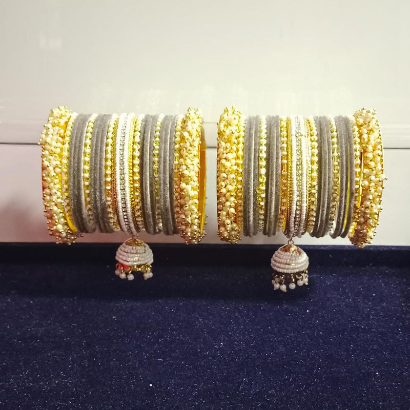 Pooja Bangles Gold Plated Austrian Stone And Pearls Velvet Bangles Set