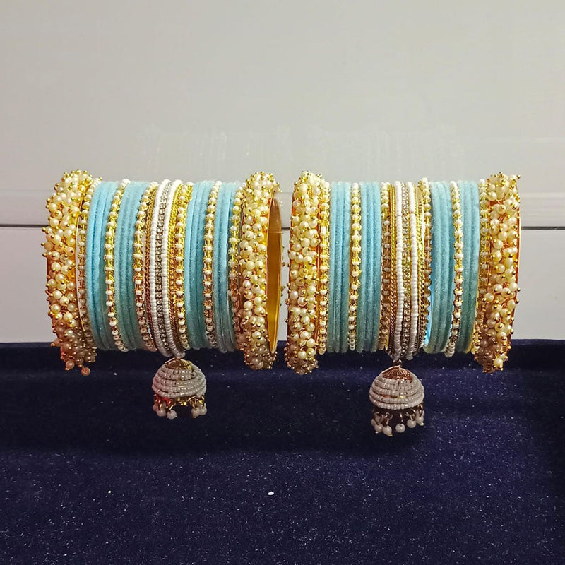 Pooja Bangles Gold Plated Austrian Stone And Pearls Velvet Bangles Set