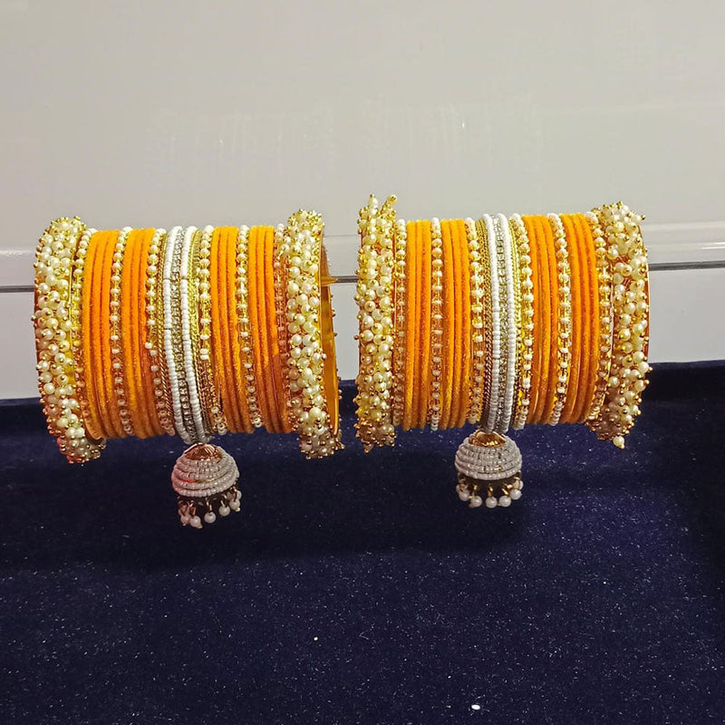 Pooja Bangles Gold Plated Austrian Stone And Pearls Velvet Bangles Set