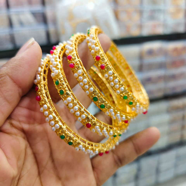 Pooja Bangles Gold Plated Pota Stone And Pearls Bangle Set