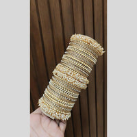 Pooja Bangles Delicate Gold Plated Pearl Work Bangles Set