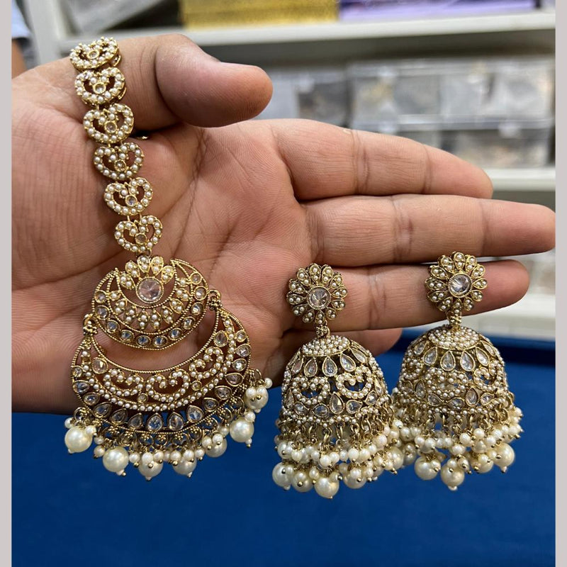 Hira Collections Gold Plated Crystal Stone And Pearls Jhumki Earrings With Maangtikka