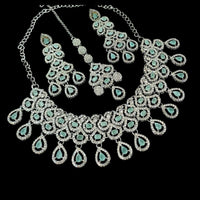 NAFJ Glamorous Crystal Stone And Austrian Stone Designer Necklace Set With Maangtikka