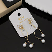 Klitz Shimmering Crystal Stone Butterfly Shape And Pearl Dangler Earrings