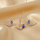 Etnico Latest Stylish Rose Gold Plated CZ American Diamond Pendant Brass Necklace Set with Earrings for Women