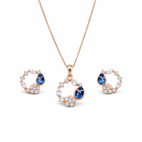 Etnico Latest Stylish Rose Gold Plated CZ American Diamond Pendant Brass Necklace Set with Earrings for Women