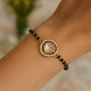Etnico Gold Plated Traditional Adjustable Black Beads Mangalsutra Bracelet with White Pendant for Women (MB009W)