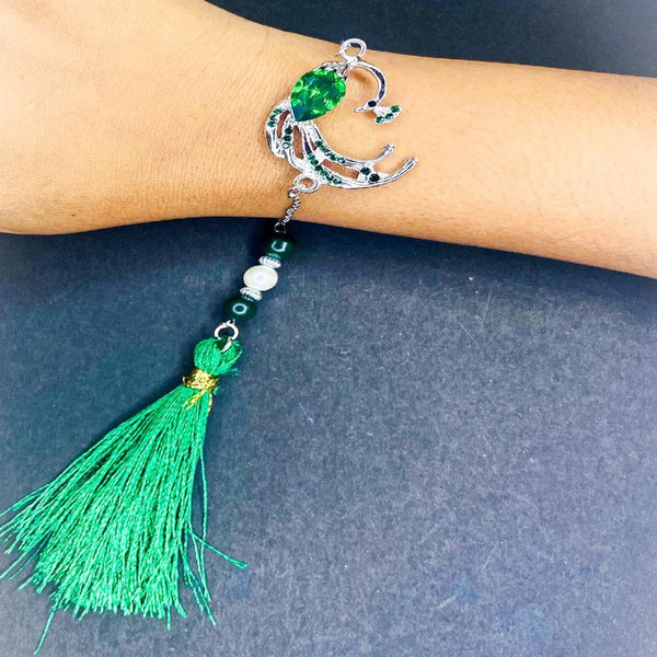 Mahi Rhodium Plated Peacock-Shaped Green Crystals Lumba Rakhi with Tassel for Bhabhi (RAL1100793RGre)