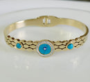 Tarohi Jewels Stainless Steel Gold Plated Turquoise Evil Eye Kada- STKD 4840