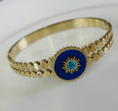 Tarohi Jewels Stainless Steel Gold Plated Lashes Evil Eye Kada- STKD 4845