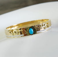 Tarohi Jewels Stainless Steel Gold Plated Turquoise Oval Shaped Kada- STKD 4849