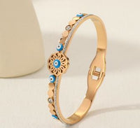 Tarohi Jewels Stainless Steel Gold/Rosegold Plated Floral Shaped Evil Eye Kada- STKD 4883