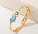 Tarohi Jewels Stainless Steel Gold/Rosegold Plated Interlinked Enamel Evil Eye Kada- STKD 4910