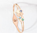 Tarohi Jewels Stainless Steel Gold/Rosegold Plated Flower Design Evil Eye Kada- STKD 4917