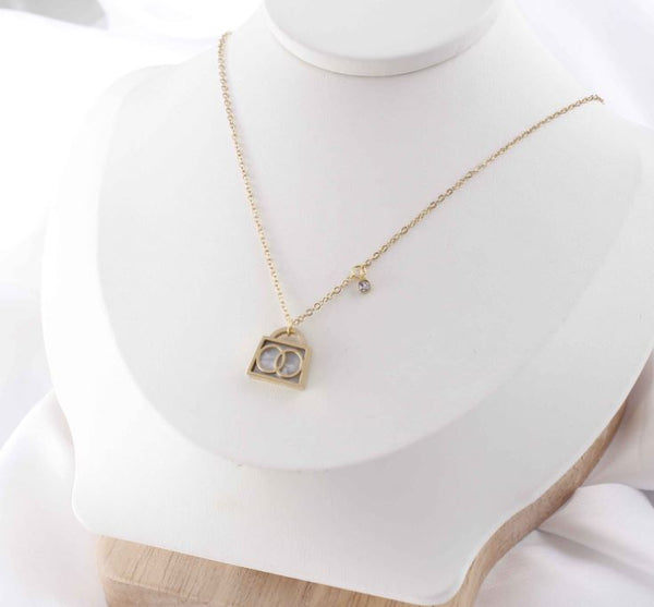 Stainless Steel Bag Shape Inside Moving Cubic zirconia Necklace - STNK 5002