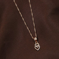 Etnico Rose Gold Plated Glittering CZ Zircon Heart Chain Pendent Necklace for Women & Girls (CH54RG)