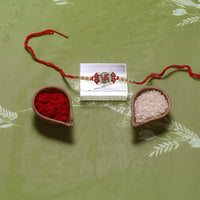 Kord Store 'Swastik' Mark Mint Green And Ruby Minakari Thread Moti Gold Finish Rakhi Set Of 1 For Brother