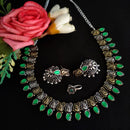 Vaamika Oxidised Plated Dual-Tone Stone Necklace set with Earrings and Nosepin